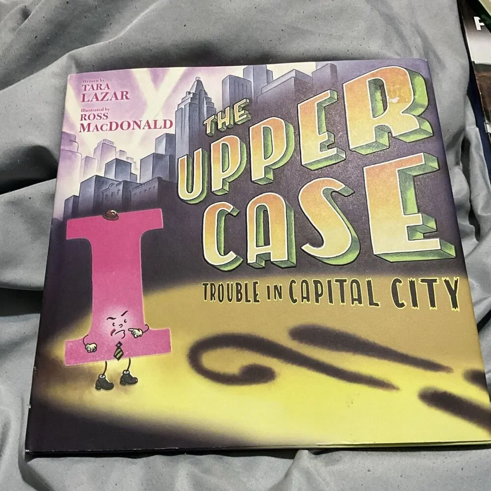THE UPPER CASE TROUBLE IN CAPITAL CITY HARDCOVER W/ DUST COVER 1ST ED. 2019 NEW